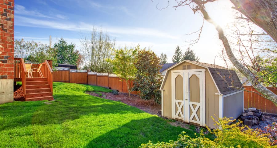 Fenced backyard with storage shed in Greenville