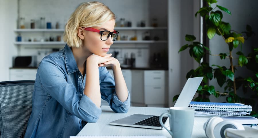 Young professional using computer in home workspace